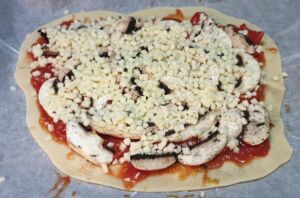 Pizza tomates cerises mozzarella champignons